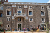 <center>L'abbaye Sainte-Marie-d'Arles-sur-Tech </center>Le Palau est une bâtisse de la fin du XIXe siècle dont la façade est enrichie de quatre fenêtres du XIVe siècle, remanée à la fin du XIXe siècle. Libéré des Sarrasins au VIIIe siècle, le Vallespir est repeuplé par des chrétiens fuyant l'Espagne musulmane à qui Charlemagne donne des terres à cultiver. C'est dans le contexte de la Reconquête qu'est fondée l'abbaye Sainte-Marie-d'Arles par un moine bénédictin venu de la péninsule ibérique, un certain Castellan.
Les premiers religieux se sont installés dans des bâtiments anciens, probablement romains, qui ont été détruits puis reconstruits. Placée sous la protection des Comtes de Cerdagne, l'abbaye prospère grâce à ses nombreuses donations (prieurés, hospices, etc.) et à ses pèlerinages qui lui confèrent un rôle économique et culturel majeur.