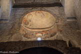 <center>L'abbaye Sainte-Marie-d'Arles-sur-Tech </center>Un escalier à double volets menait à la chapelle haute (St Michel) lors des célébrations processionnelles. Décor à fresques datables du XIIe siècle, avec deux figures d'anges (séraphins aux ailes décorées d'yeux) et, au dessus, le Christ en majesté entouré des quatre évangélistes.