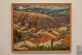 <center>Musée d'Art Moderne de Céret</center>Maurice Loutreuil (1885-1925)
El carrer llarg ou Les toits vus du Castellas, Céret
Printemps 1919
Huile sur toile. Séjour à Céret de mars à mai 1919
Curieux, insatiable, Loutreuil s'intéresse à tous les mouvements artistiques du moment : fauvisme, cubisme, dadaïsme, futurisme. Il fréquente les cafés littéraires et artistiques de Montparnasse et la Rotonde.
La lumière du Sud le captive. Ici la succession de plans rigoureux mène le regard des bâtisses du village vers la ligne des platanes, jusqu'aux Aspres, derniers contreforts avant l'espace du ciel.