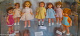 <center>Poupées Bella</center>Les modèles de poupées exposés se déclinent de la fin des années 40 au début des années 80, du « microbe » à la poupée mannequin, la poupée des années 50, aux membres charnus et à l’expression enfantine, est fabriquée en rhodoïd. Les différentes parties du corps sont peintes et assemblées, les yeux placés et la perruque collée. Dans les années 60, les matériaux changent avec l’arrivée du plastisol et l’implantation mécanique des cheveux qui révolutionnent le milieu de la poupée. A cette même période, Bella produit ces plus grands succès commerciaux avec la naissance de Tressy en 1966, de microbe et de Cathy en 1967. Ces modèles stars seront déclinés jusqu’à la fermeture de l’usine en 1984, aux côtés des nombreuses nouveautés proposées chaque année et qui ont fait la réputation de l’entreprise.