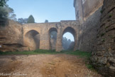 <center>Château de Suze-la-Rousse</center>En 1173 Tiburge II d'Orange (petite-fille du comte Rambaud II d'Orange et descendante de Guillaume) épouse Bertrand Ier des Baux à qui elle apporte la terre de Suze. Ce dernier fait bâtir un château fort militaire à demi incrusté dans la roche ocre, doté de remparts défensifs gigantesques, de douves profondes et d'un pont-levis, de créneaux, d'un puits de 34 mètres, d'une chapelle Saint-Turquois, sur une colline qui domine le village de Suze.