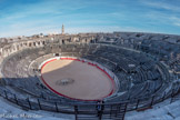 Les Arènes. <br> Histoire des restaurations.
XIXe siècle : Les premiers travaux sont réalisés au début du siècle sous la direction de Stanislas-Victor Grangent, ingénieur des ponts et chaussées : renforcement de linteaux au premier étage, reconstitution de nombreux escaliers d'accès à la galerie supérieure et aux gradins, dégagement de la piste. Lors de sondages, il découvre le sous-sol de la piste sans pouvoir le dégager complètement.
En 1864, l’architecte Henri Revoil dégage le sous-sol de la piste, appelée salle cruciforme en raison de sa forme. A la fin du XIXe siècle, l’intérieur de l'amphithéâtre présente un aspect proche de l’état actuel.